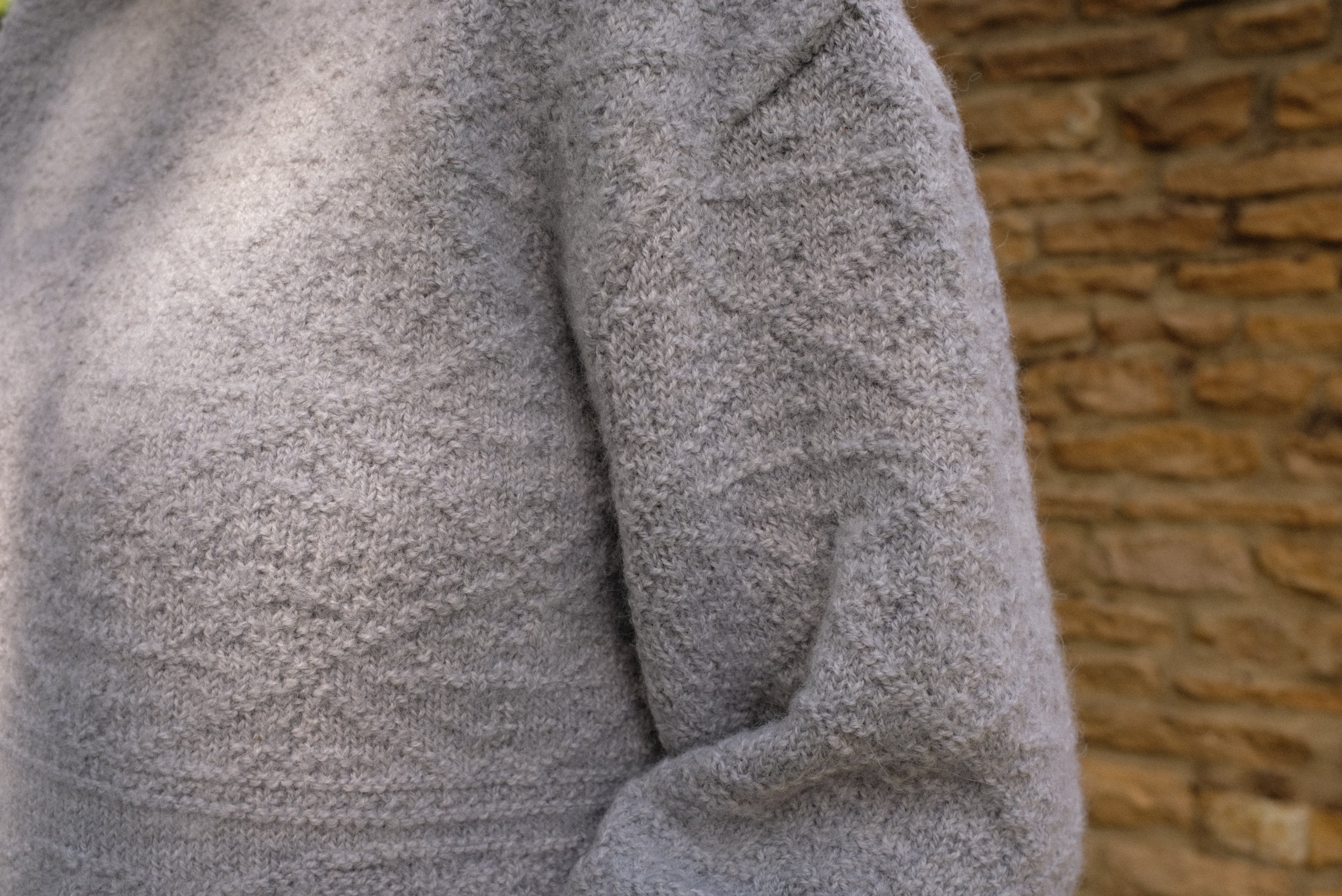 Detail of the Cloud Stitch Jumper in grey, showcasing its textured stitch for sustainable knitwear jumper.